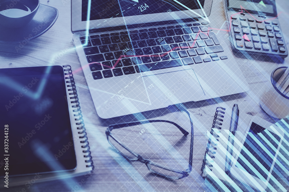 Financial market graph hologram and personal computer on background. Double exposure. Concept of forex. Financial market graph hologram and personal computer on background. Double exposure. Concept of forex.