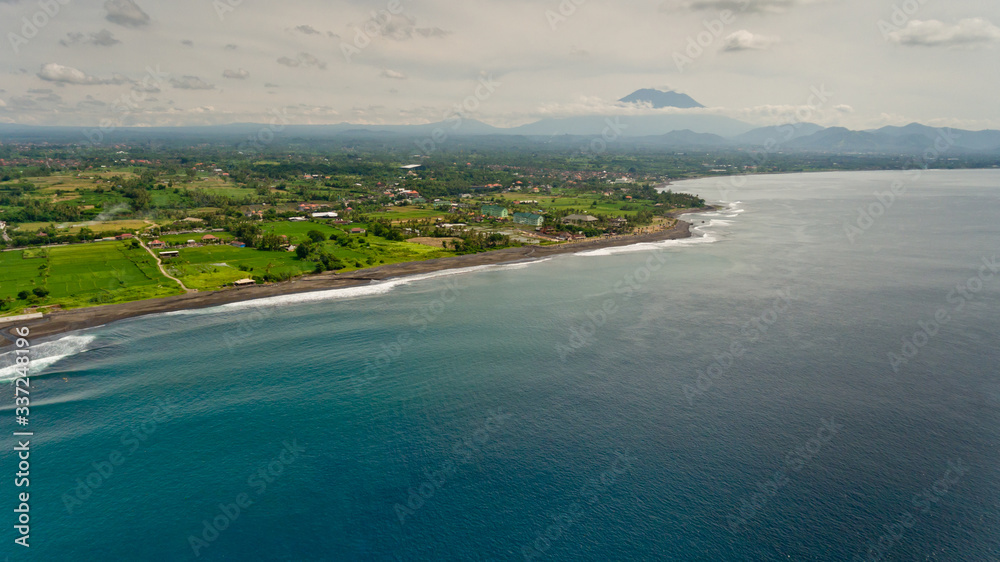 Aerial view of  black sand beach.  Surfing beach Bali, Indonesia.