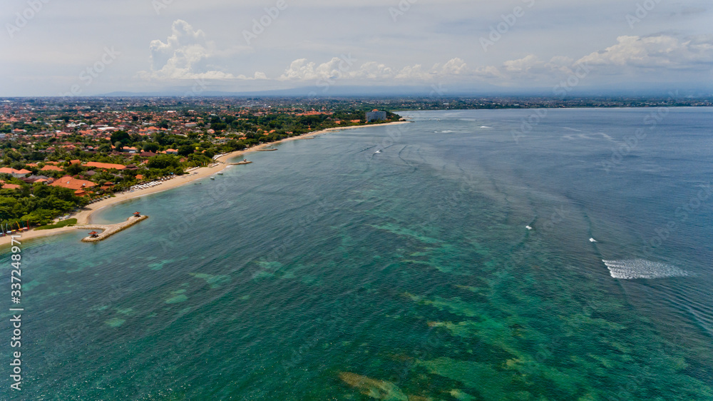 Beautiful city beach of Sanur. Aerial view, Bali, Indonesia. Background.