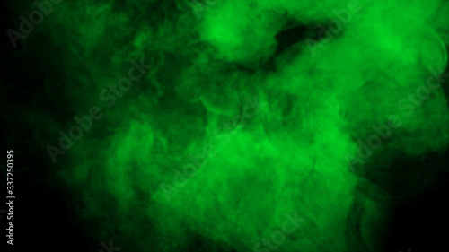 Smoke on the floor. Isolated black background. Misty green fog film effect texture overlays for text or space.