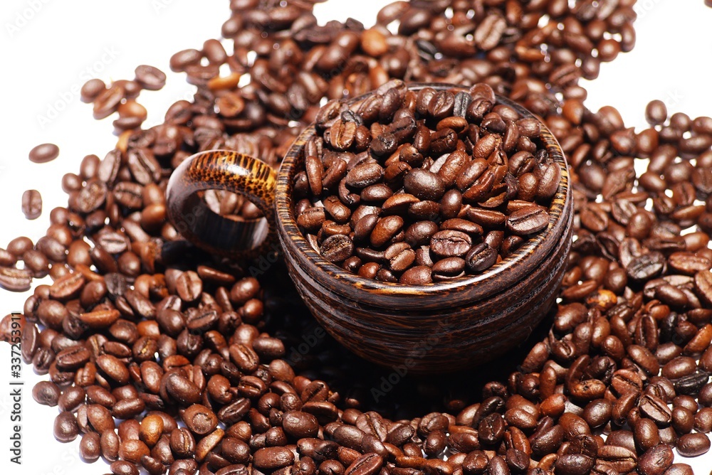 Fototapeta premium Wooden cup and coffee bean on isolate white background , selective focus .