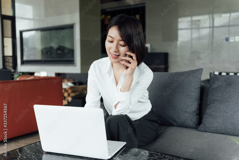 An Asian business woman with short hair is working An Asian business woman with short hair is working