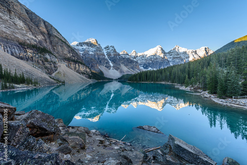 Fototapeta Naklejka Na Ścianę i Meble -  Moraine Lake is a glacier lake in Banff National Park, Canada. It lies fourteen kilometres from the village of Lake Louise in the Valley of the Ten Peaks