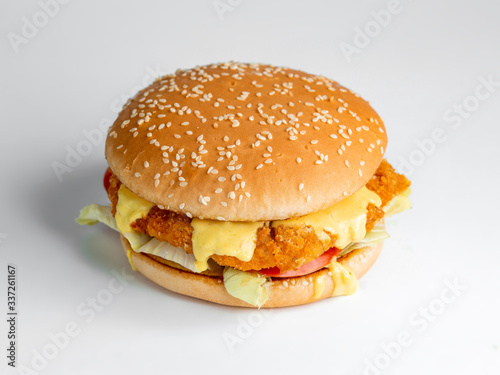 chicken burger with cheese and vegetables