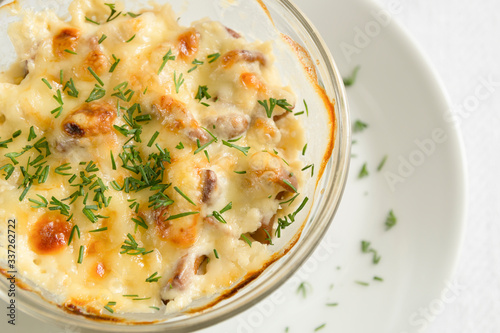 julienne with mushrooms, covered with cheese crust and sprinkled with dill