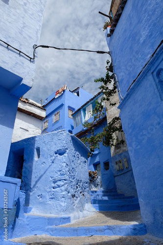 An old blue painted street in city of  Chefchaouen,Morocco. © leospek