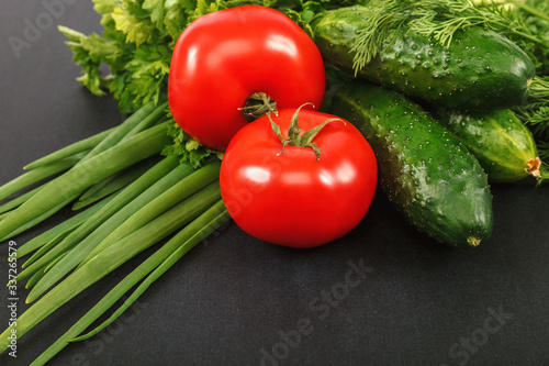 Fresh vegetables assorted on a black background