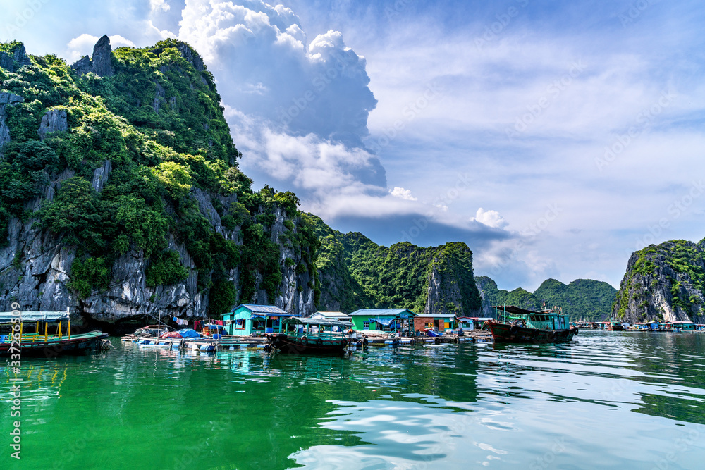 Fototapeta premium Floating fishing village and rock island in