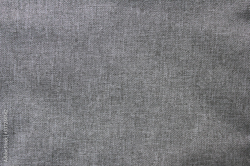 Gray texture empty wavy cloth pattern. Soft creasy grey background, empty dark cotton material wallpaper. Blank seamless cloth structure