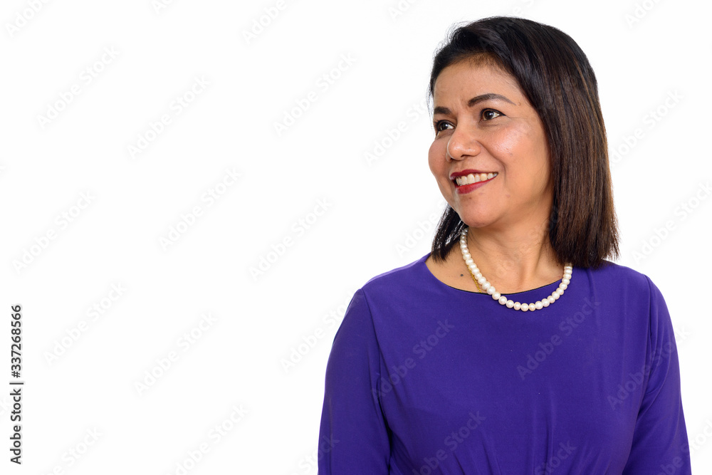 Studio shot of happy mature Asian woman isolated against white background Studio shot of happy mature Asian woman isolated against white background