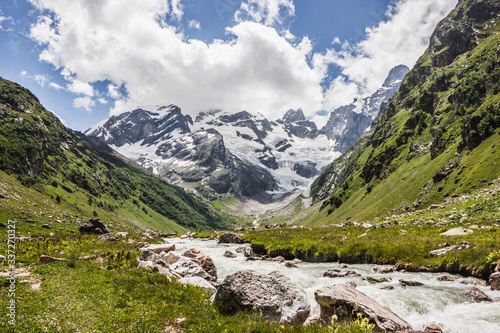 Alpine meadows and rocks in the Caucasus mountains in Russia. Peak Dalar. © yuliagubina