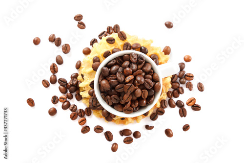 Waffle cookies and coffee grains on a white background