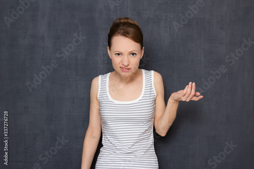 Photos Portrait of dissatisfied indignant young woman rebuking somebody