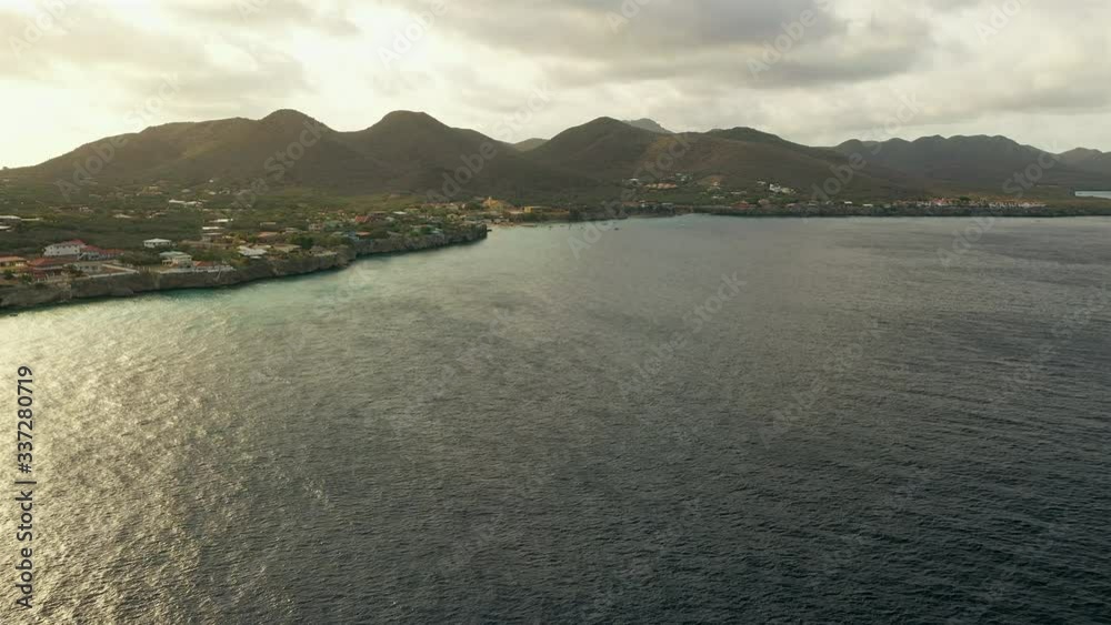 Aerial view of coast of Curacao in the Caribbean Sea with turquoise water, cliff, beach and beautiful coral reef Aerial view of coast of Curacao in the Caribbean Sea with turquoise water, cliff, beach and beautiful coral reef