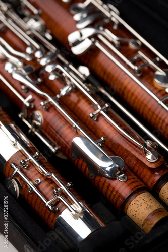 Wooden bassoon isolated on a black background. Music instruments. © juananbarros