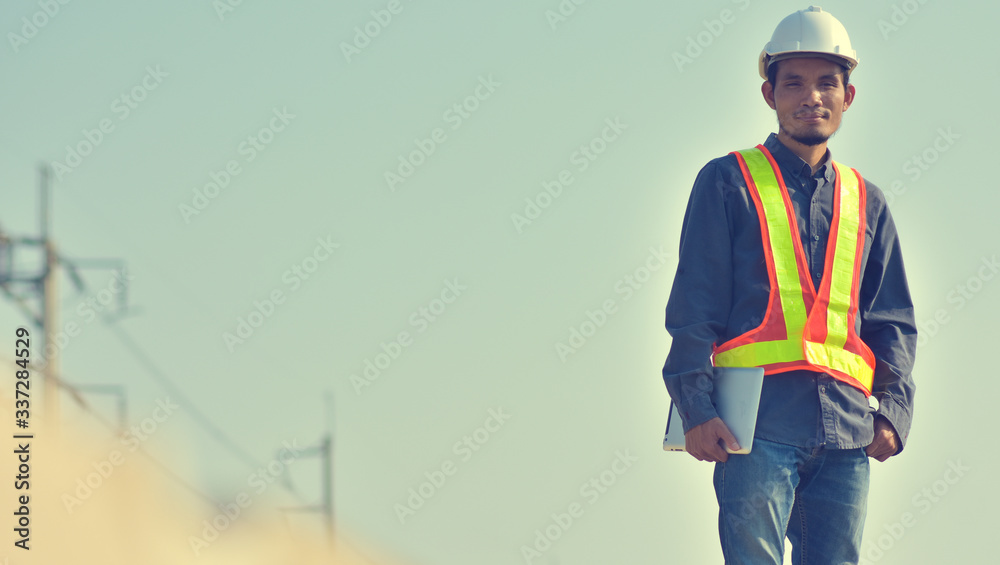 Supervisor construction worker control a on construction site and sunset background Supervisor construction worker control a on construction site and sunset background