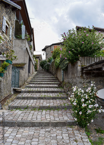 YVOIRE  FRANCE -JUNE 27  2019- View of a magnificent stone staircase from the medieval village of Yvoire  classified as one of the most beautiful villages in France  on the shores of Lake Leman