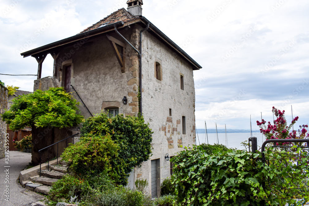 YVOIRE, FRANCE -JUNE 27, 2019- View of a magnificent stone staircase from the medieval village of Yvoire, classified as one of the most beautiful villages in France, on the shores of Lake Leman