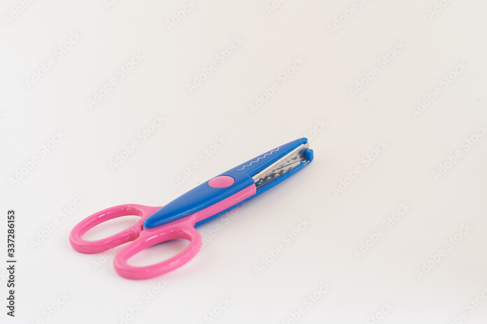 Pink and blue scissors for school crafts on white background. Pink and blue scissors for school crafts on white background.