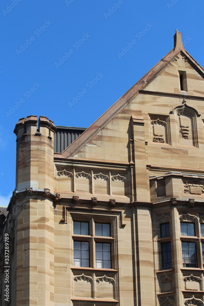A sandstone building in the city. The building is Registrar-General's building also known as Land Titles Office. 1 Prince Albert Rd, Sydney. 