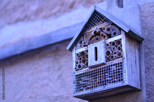homemade wooden insect house for outside photo