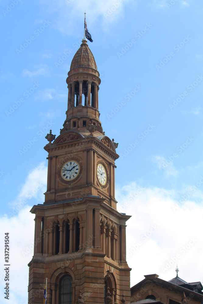 Sydney Town Hall Clock tower with a blue sky back ground. Richly decorated nineteenth century high victorian sandstone building. Second Empire Style architecture. Australia
