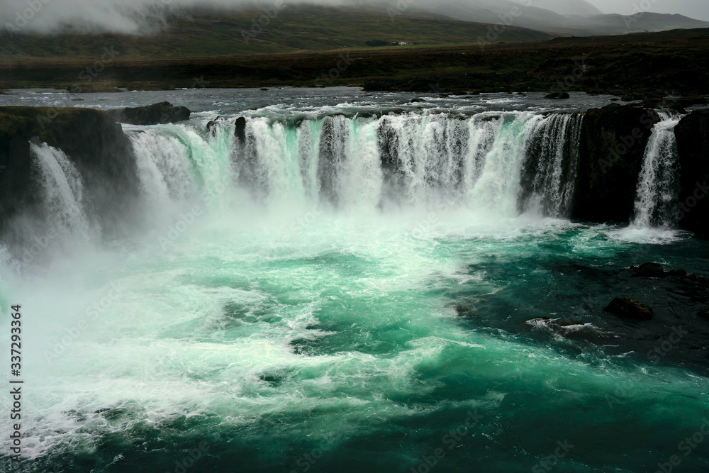 The Godafoss Icelandic: Goðafoss waterfall of the gods, is a famous waterfall in Iceland. The Godafoss Icelandic: Goðafoss waterfall of the gods, is a famous waterfall in Iceland.