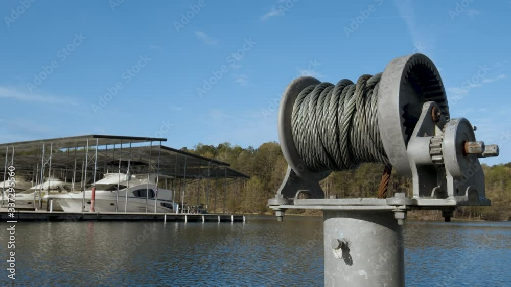 Winding Cable Post with Boats Parked at Dock on Lake Winding Cable Post with Boats Parked at Dock on Lake
