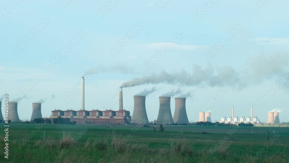 Coal powerstation and green fields Coal powerstation and green fields