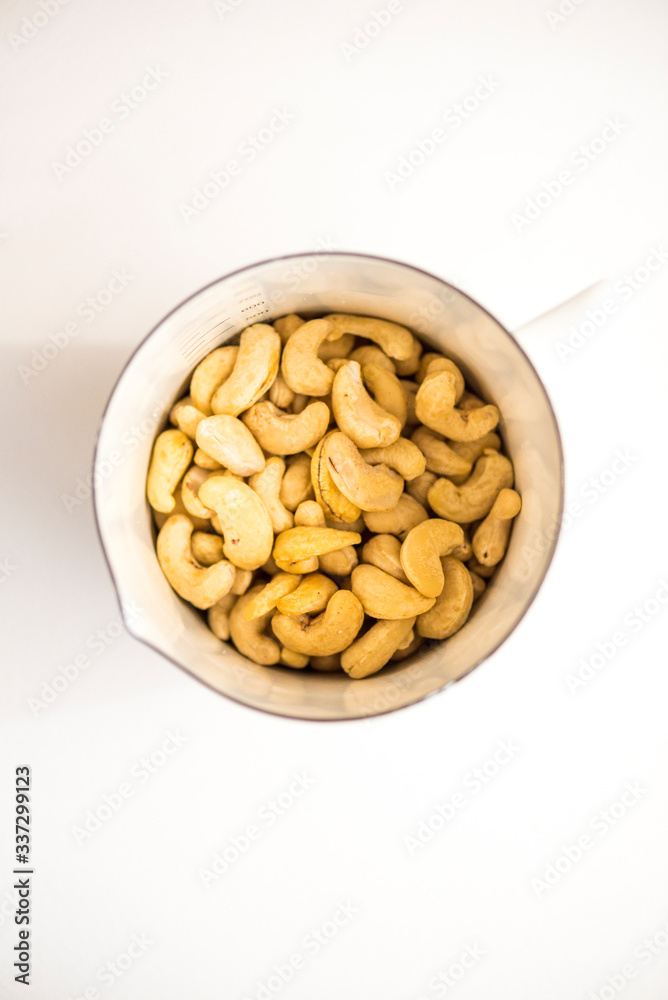 Cashew Nuts in white pot Cashew Nuts in white pot
