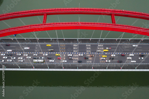 Aerial drone shot of Caiyuanba Changjiang bridge on Yangtze River in Chongqing, southwest China