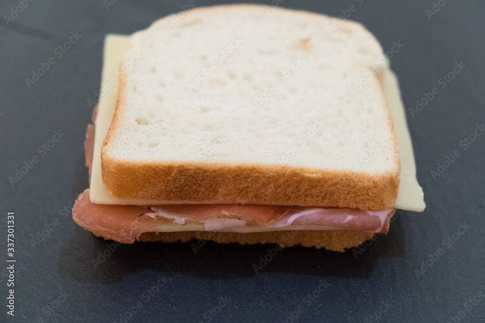 Toast, slices of white bread stuffed with speck and cheese.