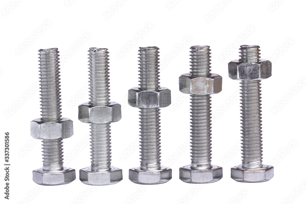 A row of metallic silver hexagon head bolts with screwed nuts closeup isolated on a white background. Steel shiny bolt with thread and nut in macro. A row of metallic silver hexagon head bolts with screwed nuts closeup isolated on a white background. Steel shiny bolt with thread and nut in macro.