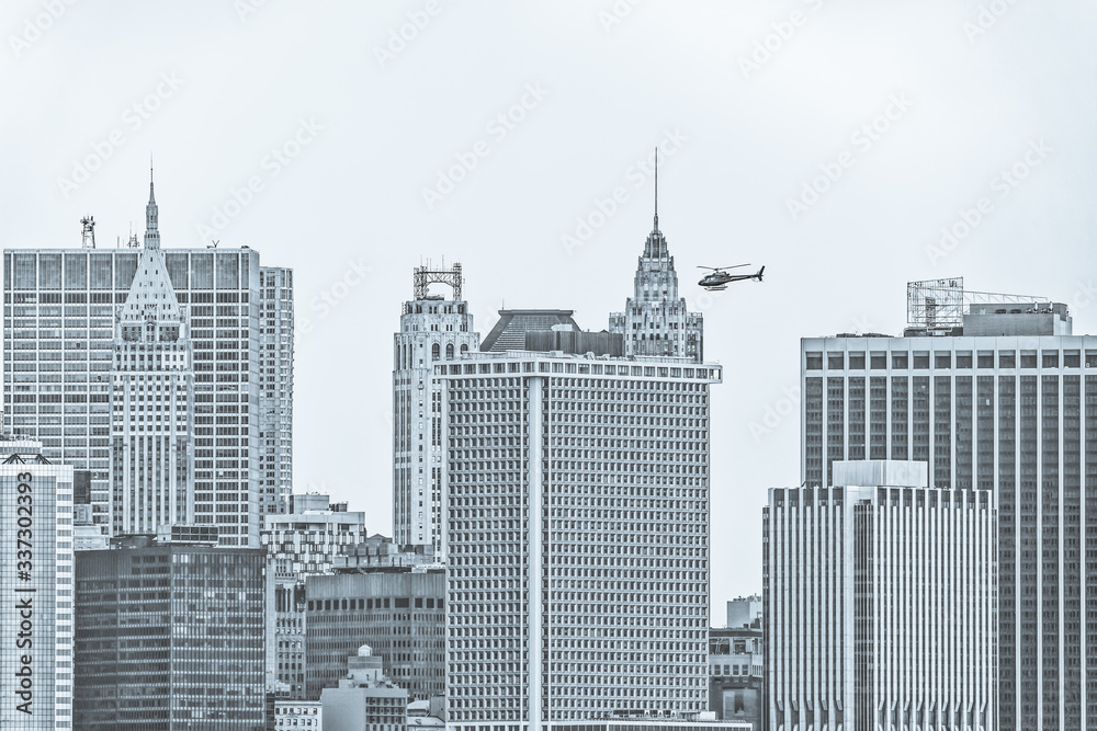 Manhattan Island buildings tops during the gloomy weather from the Staten Island Ferry in New York.