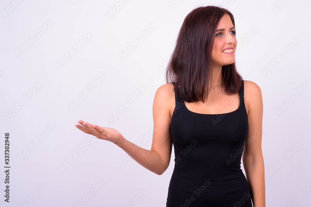 Portrait of happy young beautiful woman showing something Portrait of happy young beautiful woman showing something