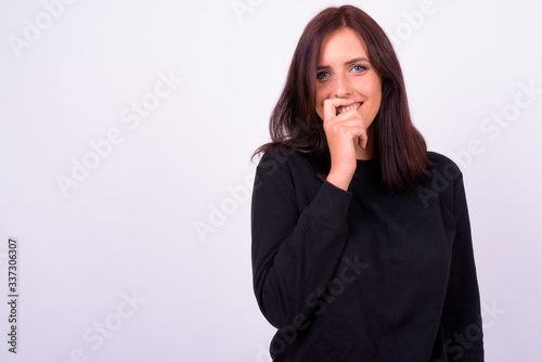 Portrait of happy young beautiful woman thinking