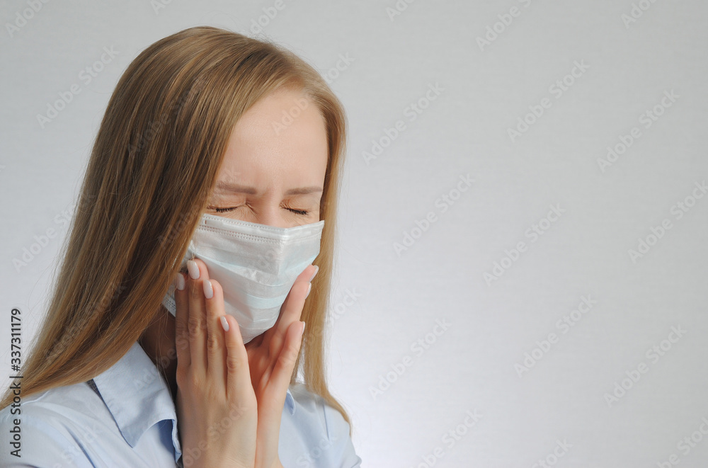 young blonde girl with toothache with medical mask young blonde girl with toothache with medical mask