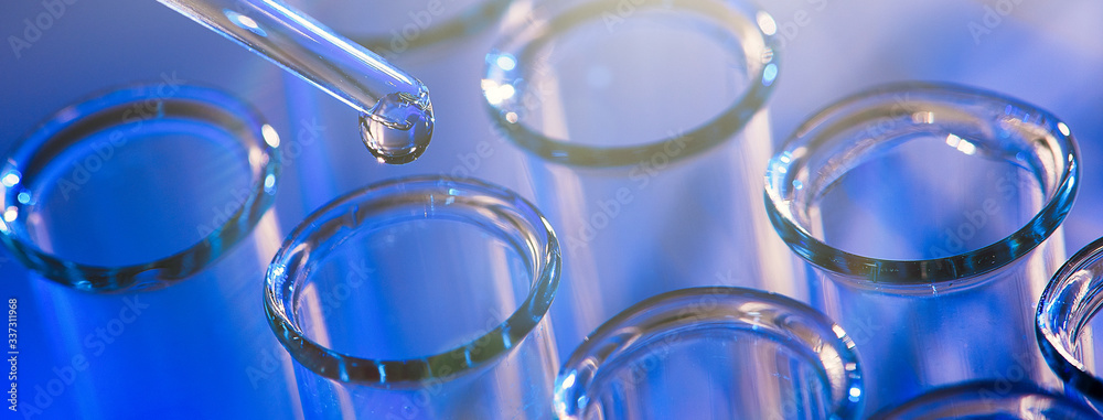 Test tube row. Concept of medical or science laboratory, liquid drop droplet with dropper in blue tone background, close up, micro photography picture. Test tube row. Concept of medical or science laboratory, liquid drop droplet with dropper in blue tone background, close up, micro photography picture.
