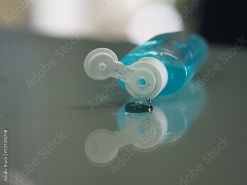 Gel bottles placed with water flowing down on the table Hand Sanitizer to prevent germs protect Contagious disease corona virus, covid-19