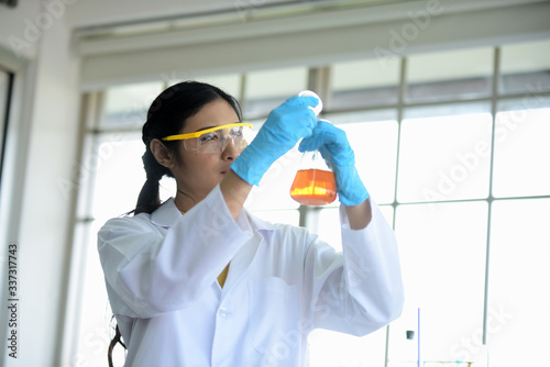 Scientists are working in science labs.Close-up of a scientistYoung female scientist looking through a microscope in a laboratory doing research  microbiological analysis  medicine.