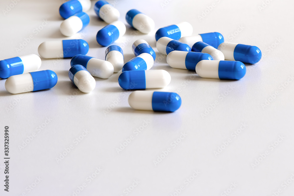 Pain medicine. Capsules of an anti-inflammatory drug are on the table. Pain medicine. Capsules of an anti-inflammatory drug are on the table.