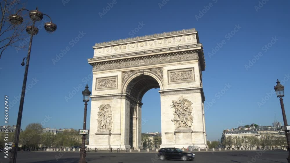 Paris street with the Arc de Triomphe in Paris, France. Paris street with the Arc de Triomphe in Paris, France.