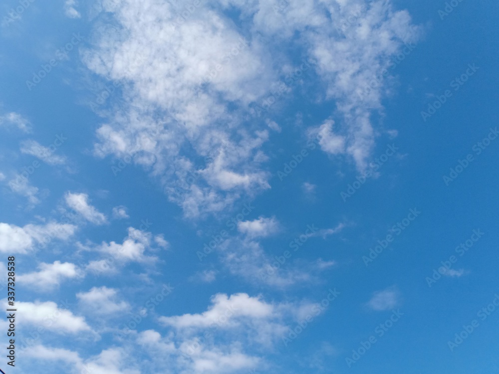 white clouds with blue sky