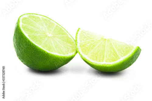 lime on a white background. two slices of lime lovely fruit. kind of citrus