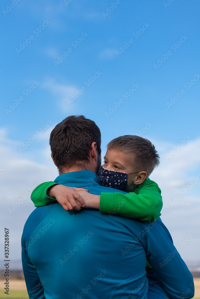 Covid 19. Father with son with masks.