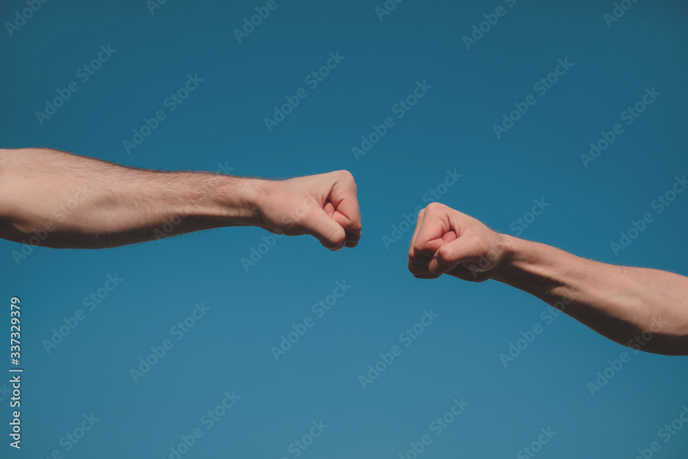 two hands shaking hands. Strong hands. Hands concept. Sky background. 