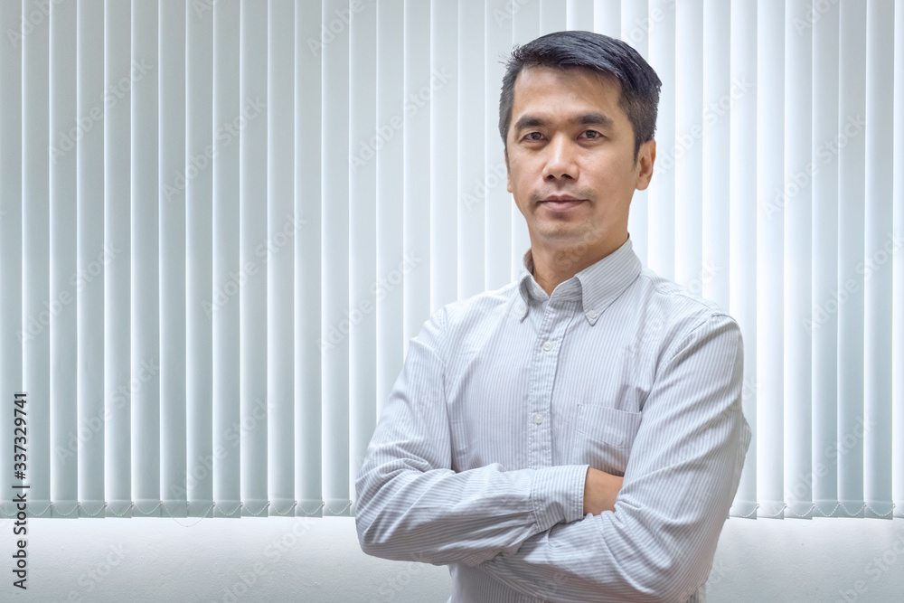 Cheerful asian businessman cross arm posing and looking at camera. Isolated with clipping path image. Cheerful asian businessman cross arm posing and looking at camera. Isolated with clipping path image.