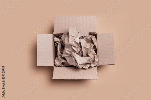 Full box of wrinkled paper. Excess packaging concept. Copy space