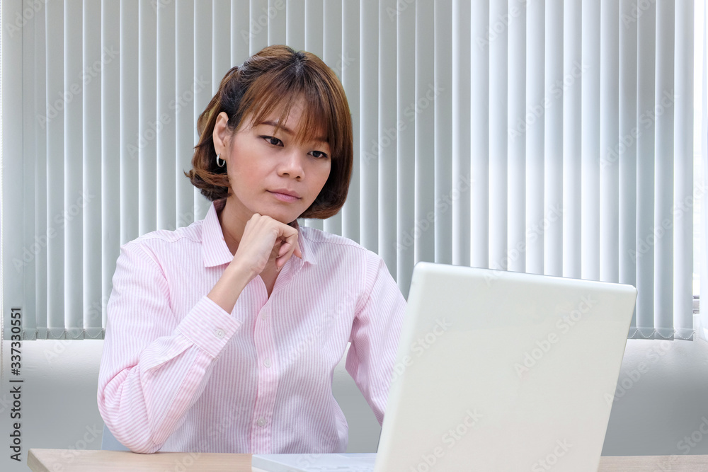 Modern young asian business woman working with laptop at workplace Modern young asian business woman working with laptop at workplace