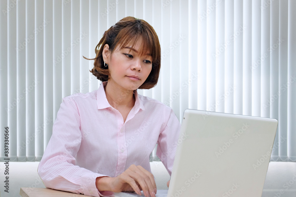Modern young asian business woman working with laptop at workplace Modern young asian business woman working with laptop at workplace
